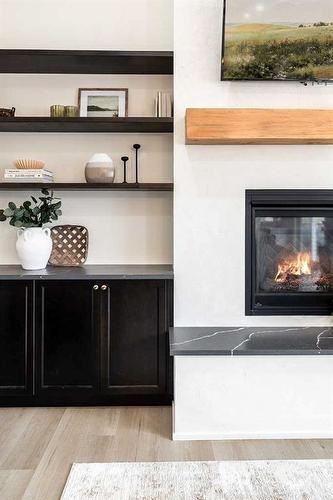 24 Heron Court Sw, Medicine Hat, AB - Indoor Photo Showing Living Room With Fireplace