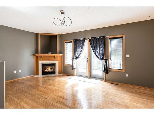 32 Stonegate Crescent Se, Medicine Hat, AB - Indoor Photo Showing Other Room With Fireplace