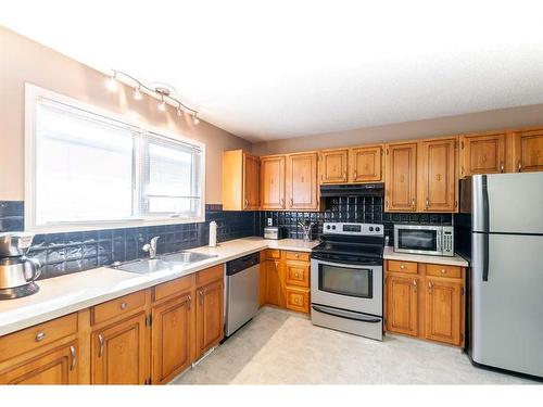 55 Markwick Drive Se, Medicine Hat, AB - Indoor Photo Showing Kitchen With Double Sink