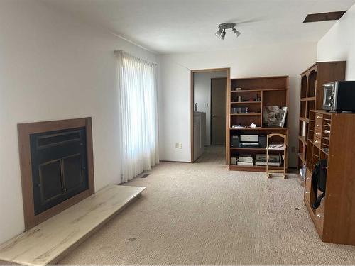 15432 Highway 41, Schuler, AB - Indoor With Fireplace