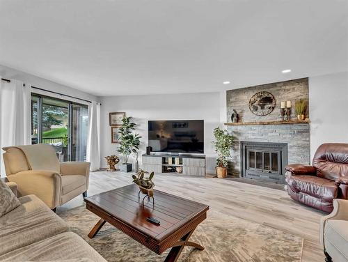 1-1165 16 Street Ne, Medicine Hat, AB - Indoor Photo Showing Living Room With Fireplace