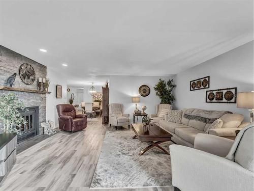 1-1165 16 Street Ne, Medicine Hat, AB - Indoor Photo Showing Living Room With Fireplace