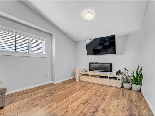 34 Sundown Road Sw, Medicine Hat, AB - Indoor Photo Showing Other Room With Fireplace