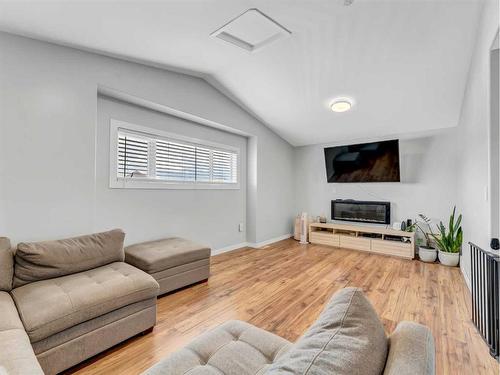 34 Sundown Road Sw, Medicine Hat, AB - Indoor Photo Showing Living Room With Fireplace