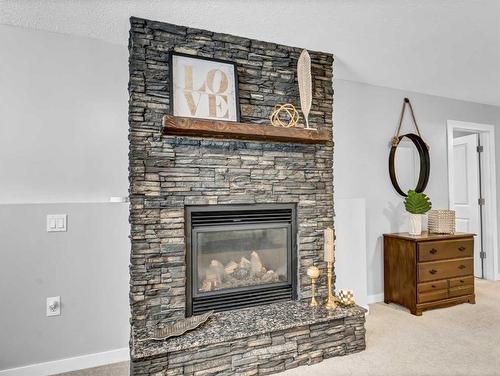 34 Sundown Road Sw, Medicine Hat, AB - Indoor Photo Showing Living Room With Fireplace