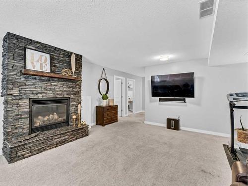 34 Sundown Road Sw, Medicine Hat, AB - Indoor Photo Showing Living Room With Fireplace