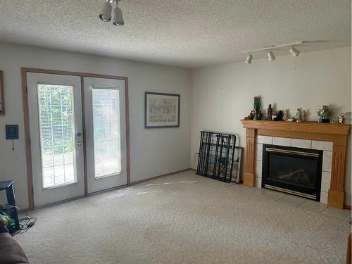 246 Stratton Way Se, Medicine Hat, AB - Indoor Photo Showing Living Room With Fireplace