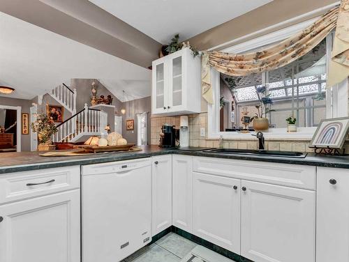 201-221 Cameron Road Se, Medicine Hat, AB - Indoor Photo Showing Kitchen With Double Sink