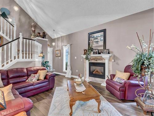 201-221 Cameron Road Se, Medicine Hat, AB - Indoor Photo Showing Living Room With Fireplace