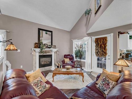 201-221 Cameron Road Se, Medicine Hat, AB - Indoor Photo Showing Living Room With Fireplace