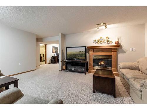 26 Park Meadows Lane Se, Medicine Hat, AB - Indoor Photo Showing Living Room With Fireplace