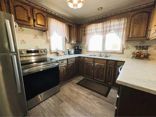 230 8 Avenue East, Bow Island, AB - Indoor Photo Showing Kitchen With Double Sink