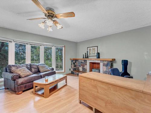 7306 Highway 523, Rural Cypress County, AB - Indoor Photo Showing Living Room With Fireplace