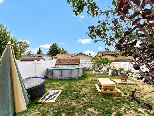 219 Ross Glen Drive Se, Medicine Hat, AB - Outdoor With Above Ground Pool With Backyard