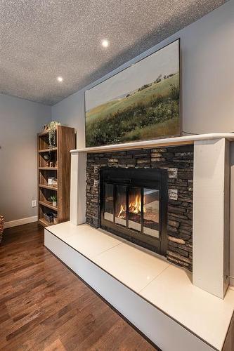 15 Ross View Close Se, Medicine Hat, AB - Indoor Photo Showing Other Room With Fireplace