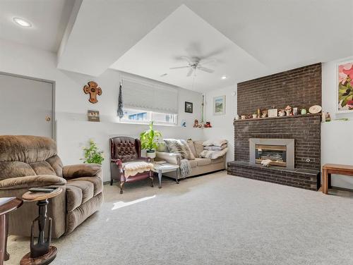 759 17 Street Ne, Medicine Hat, AB - Indoor Photo Showing Living Room With Fireplace