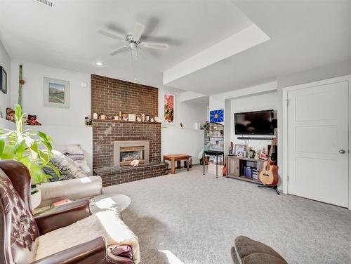 759 17 Street Ne, Medicine Hat, AB - Indoor Photo Showing Living Room With Fireplace