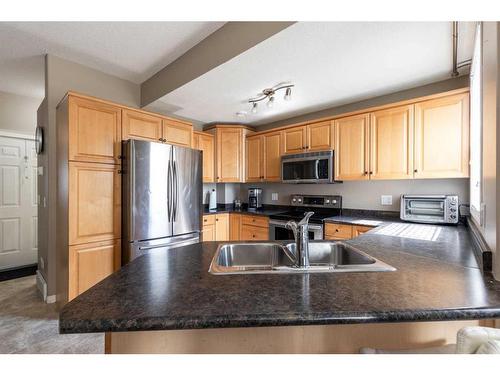 111 Northlands Way Ne, Medicine Hat, AB - Indoor Photo Showing Kitchen With Double Sink