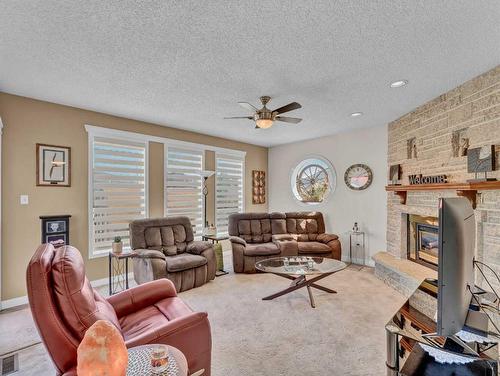 232 Ross Glen Road Se, Medicine Hat, AB - Indoor Photo Showing Living Room With Fireplace