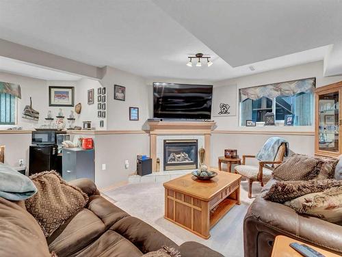 76 Schneider Crescent Se, Medicine Hat, AB - Indoor Photo Showing Living Room With Fireplace