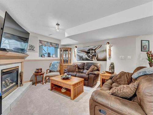 76 Schneider Crescent Se, Medicine Hat, AB - Indoor Photo Showing Living Room With Fireplace