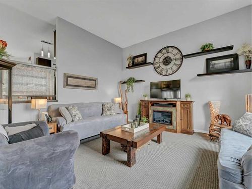 76 Schneider Crescent Se, Medicine Hat, AB - Indoor Photo Showing Living Room With Fireplace