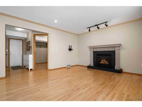 20 Stanfield Way Se, Medicine Hat, AB - Indoor Photo Showing Living Room With Fireplace