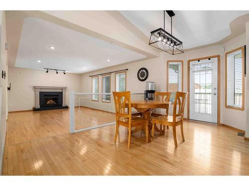 20 Stanfield Way Se, Medicine Hat, AB - Indoor Photo Showing Dining Room With Fireplace