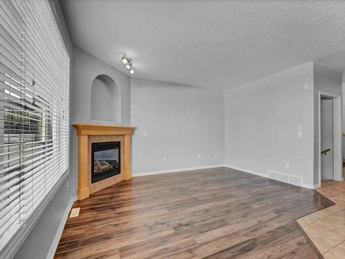 136 Sierra Drive Sw, Medicine Hat, AB - Indoor Photo Showing Other Room With Fireplace