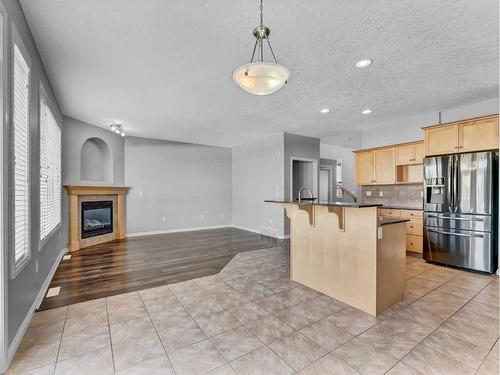 136 Sierra Drive Sw, Medicine Hat, AB - Indoor Photo Showing Kitchen With Fireplace