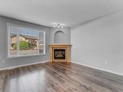 136 Sierra Drive Sw, Medicine Hat, AB - Indoor Photo Showing Living Room With Fireplace