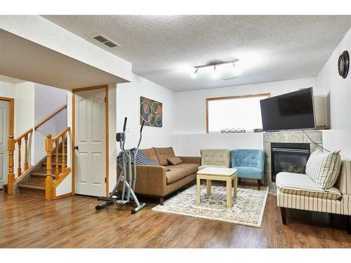 513 Vista Drive Se, Medicine Hat, AB - Indoor Photo Showing Living Room With Fireplace