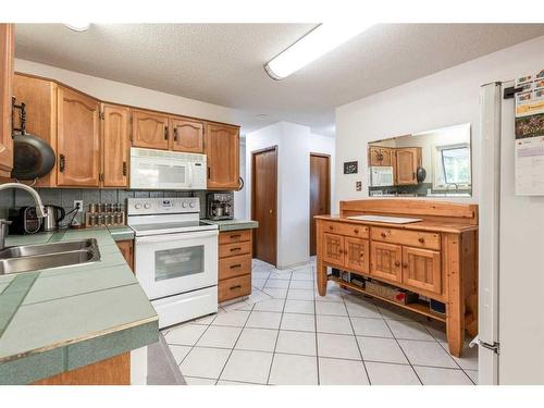 242 Carry Drive Se, Medicine Hat, AB - Indoor Photo Showing Kitchen With Double Sink