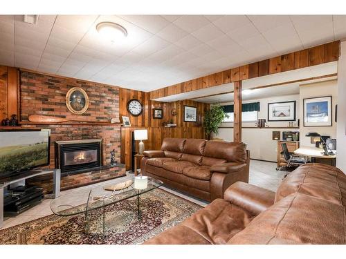 242 Carry Drive Se, Medicine Hat, AB - Indoor Photo Showing Living Room With Fireplace