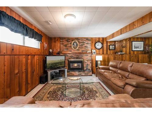 242 Carry Drive Se, Medicine Hat, AB - Indoor Photo Showing Living Room With Fireplace