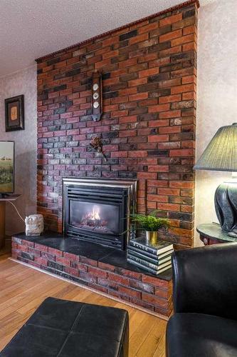 242 Carry Drive Se, Medicine Hat, AB - Indoor Photo Showing Living Room With Fireplace