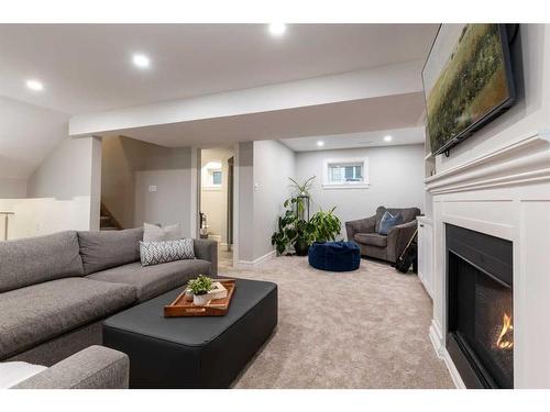 52 Cunliffe Crescent Se, Medicine Hat, AB - Indoor Photo Showing Living Room With Fireplace