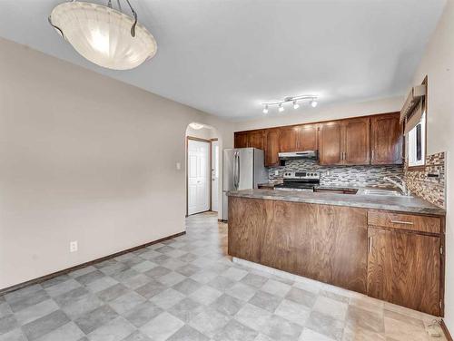 2569 24 Street Se, Medicine Hat, AB - Indoor Photo Showing Kitchen With Double Sink