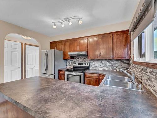 2569 24 Street Se, Medicine Hat, AB - Indoor Photo Showing Kitchen With Double Sink