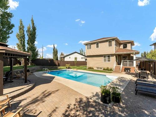 74 Terrace Court Ne, Medicine Hat, AB - Outdoor With In Ground Pool With Deck Patio Veranda With Backyard