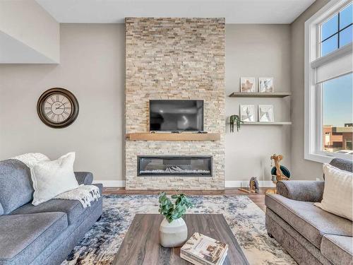 26 Palisades Lane Ne, Medicine Hat, AB - Indoor Photo Showing Living Room With Fireplace