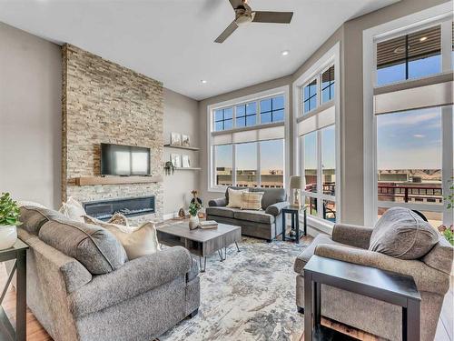 26 Palisades Lane Ne, Medicine Hat, AB - Indoor Photo Showing Living Room With Fireplace