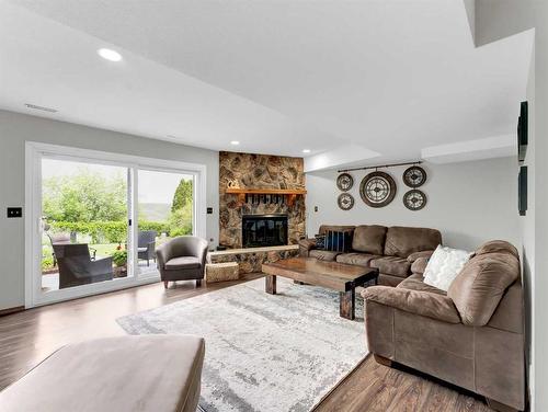 34 Cook Court Se, Medicine Hat, AB - Indoor Photo Showing Living Room With Fireplace