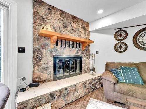 34 Cook Court Se, Medicine Hat, AB - Indoor Photo Showing Living Room With Fireplace