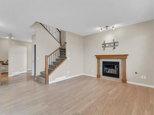 8 Terrace Avenue Ne, Medicine Hat, AB - Indoor Photo Showing Living Room With Fireplace