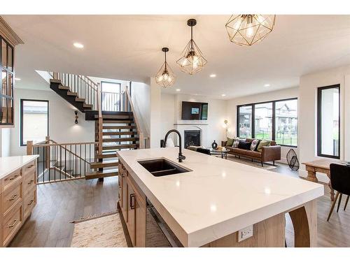 54 Dunes Link, Desert Blume, AB - Indoor Photo Showing Kitchen With Double Sink With Upgraded Kitchen