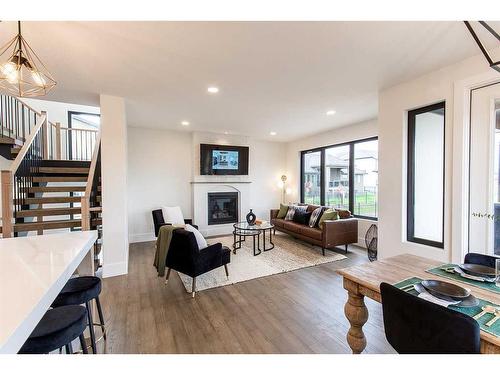 54 Dunes Link, Desert Blume, AB - Indoor Photo Showing Living Room With Fireplace