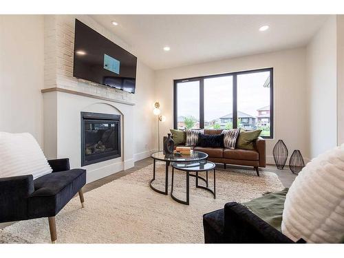 54 Dunes Link, Desert Blume, AB - Indoor Photo Showing Living Room With Fireplace