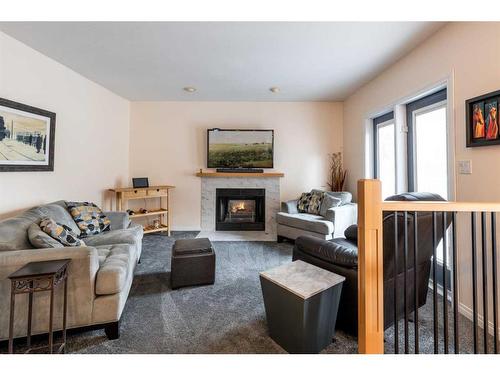 75 Palliser Way Ne, Medicine Hat, AB - Indoor Photo Showing Living Room With Fireplace