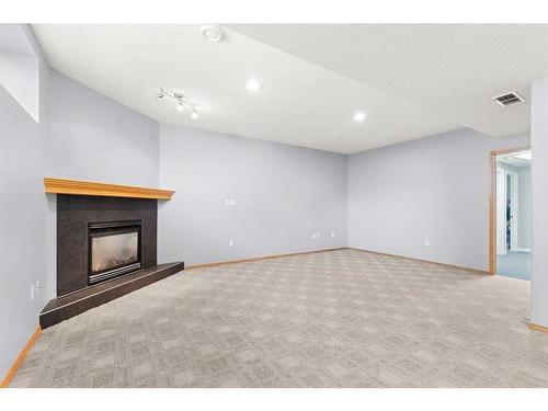 21 Cottonwood Close Sw, Medicine Hat, AB - Indoor Photo Showing Other Room With Fireplace